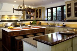 Classy Mediterranean kitchen with a striped backsplash