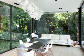 Contemporary sunroom with brilliant chandelier and dining space [Design: StudioP - Julie Engels]