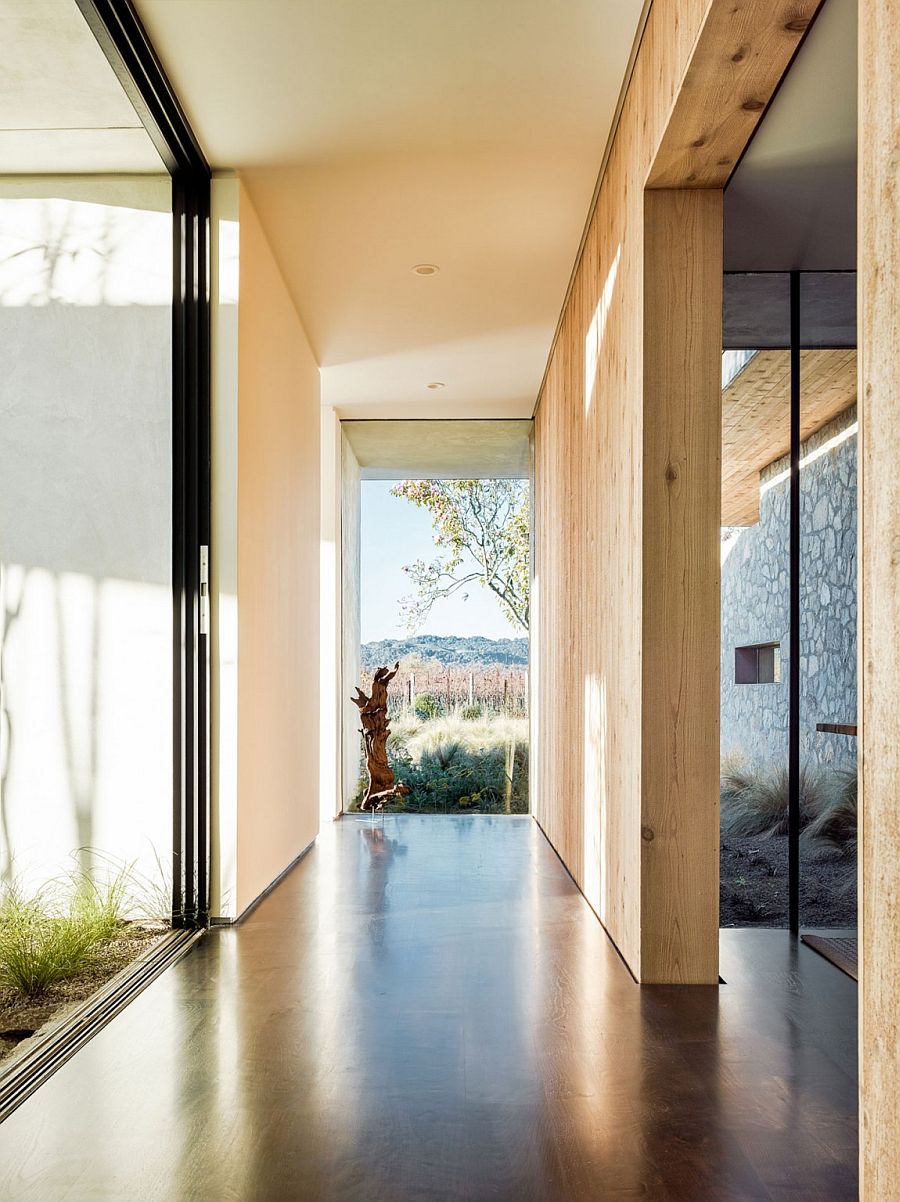 Corridors and walkways connect the two different wings of the house in stone and wood