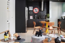 Dark backdrop and pops of color create a unique living area