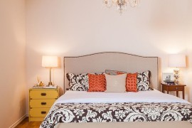 Dashing bedside table in yellow coupled with a more understated counterpart