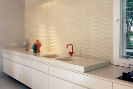 Decorative ceramic tiled backdrop in the contemporary kitchen in white