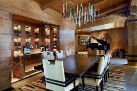 Dining area with wine storage and a unique lighting fixture