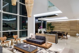 Double height living area with warm wooden tones and geometric style