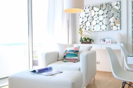 Exquisite decor in white and metallic wall art in the living room