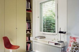 Floating bedside table above the sleek radiator
