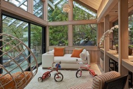 Gabled roof and woodsy warmth greet this contemporary sunroom [Design: Richard Brown Architect]