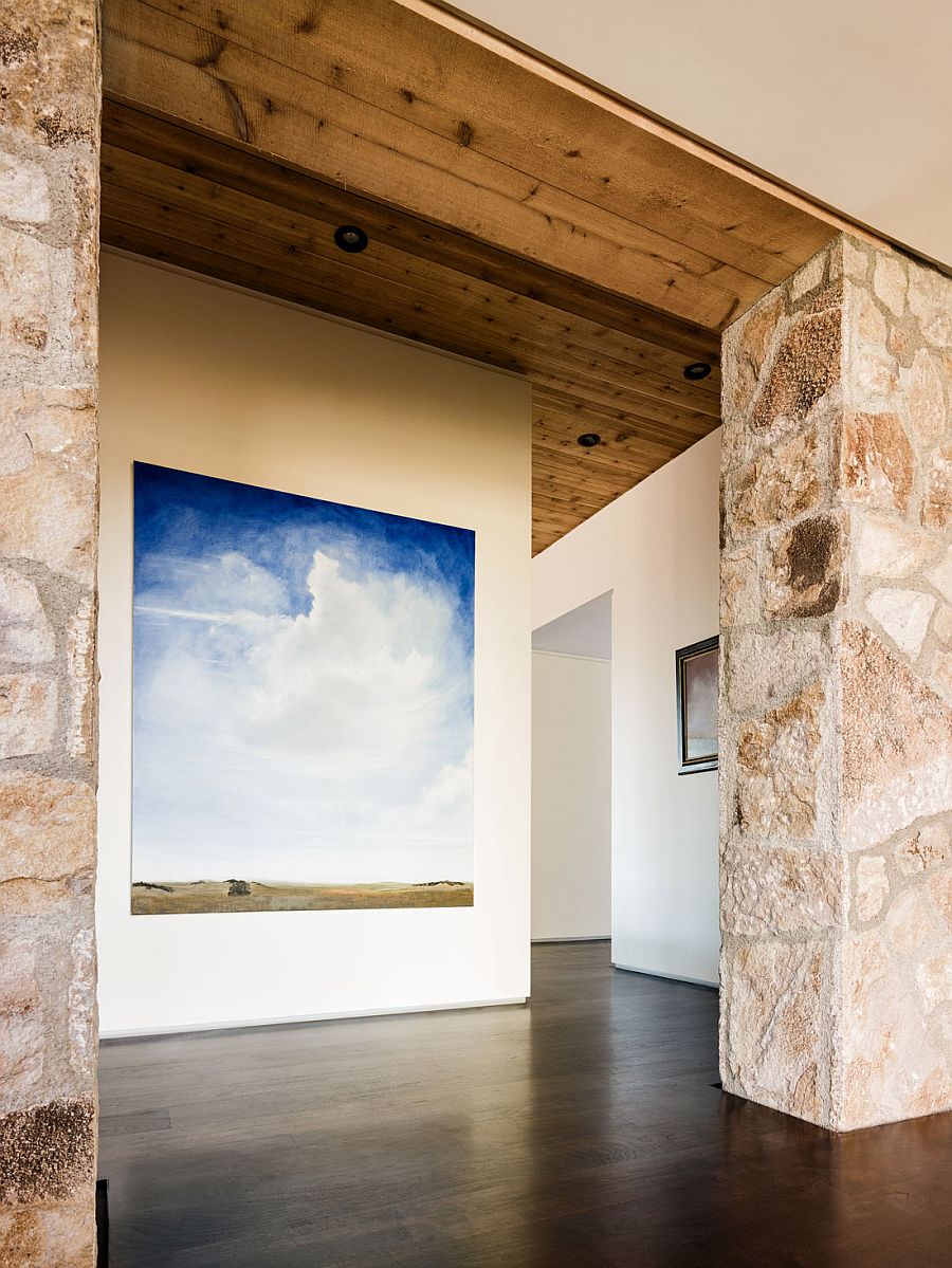 Gallery -styled entrance displays the art collection of the homeowners