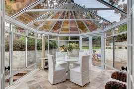 Gazebo-shaped sunroom that is all about glass