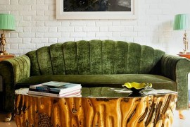 Gold Coffee table coupled with a lovely green couch [Design: Viya Interiors]
