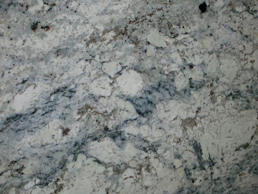 Grey and blue veining in a white ice granite slab Decoist