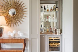 Home bar in the closet complete with a sink and mixer saves up on space