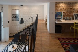 Home workspace with a sleek white desk and lovely lighting