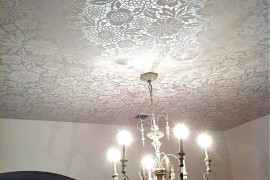 Lace ceiling treatment lit up with chandelier