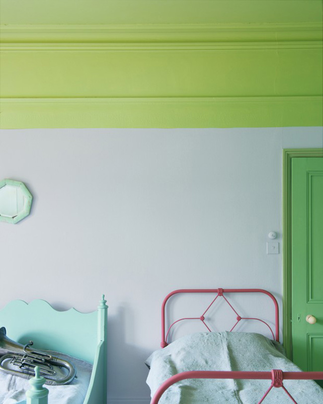 Lime green at the top of a bedroom paired with white walls