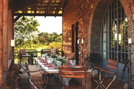Lovely outdoor dining area with a trestle table and folding chairs
