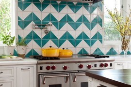 Mediterranean kitchen with a chevron pattern backsplash