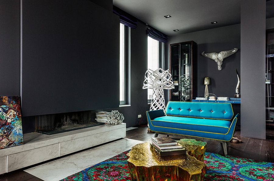 Modern apartment living room in gray with gold coffee table and a teal couch [From: luján + sicilia]