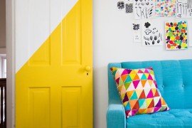 Partially bright yellow door creates a striking focal point