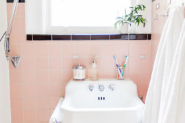 Pink and black bathroom with an original retro sink