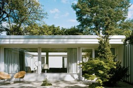 Revamped 1950s Berline home with large glass windows and sweeping courtyards