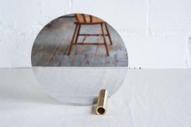 Round mirror with a brass tube