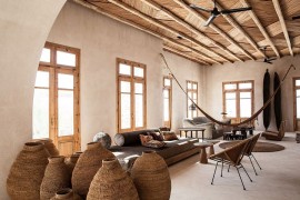 Stone houses at the Scorpios in Mykonos with unique decor and a 60s rustic syle