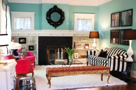 Twin table lamps bring visual symmetry to the colorful living space [Design: Judith Balis Interiors]