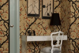 Unexpected touches in a bedroom with cherry blossom wallpaper