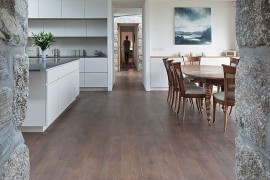 View of the contemporary addition with kitchen and dining from the bedroom