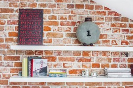 White floating shelves for the brick wall