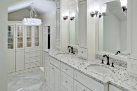White ice granite in a bright and airy powder room