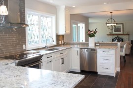 White ice granite in a kitchen with grey tile