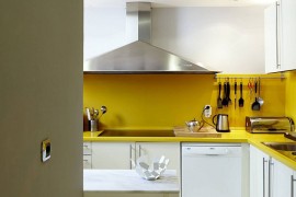 White kitchen with a vivacious yellow backsplash