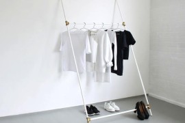 Very minimal and slanted white clothing rack