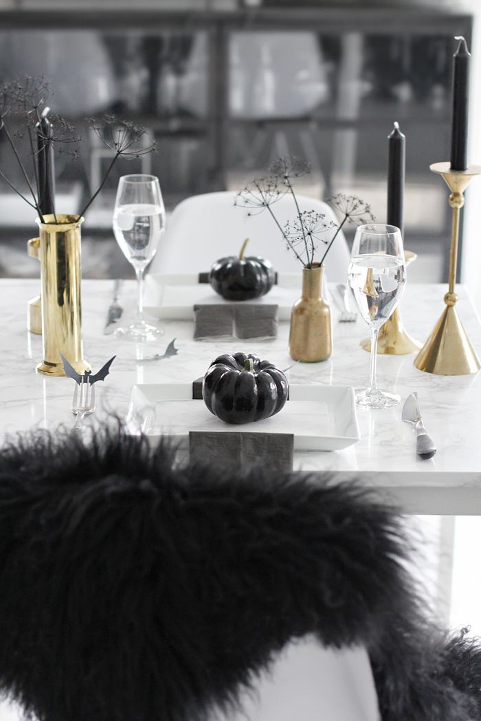 A less scary Halloween table setting in black and gold