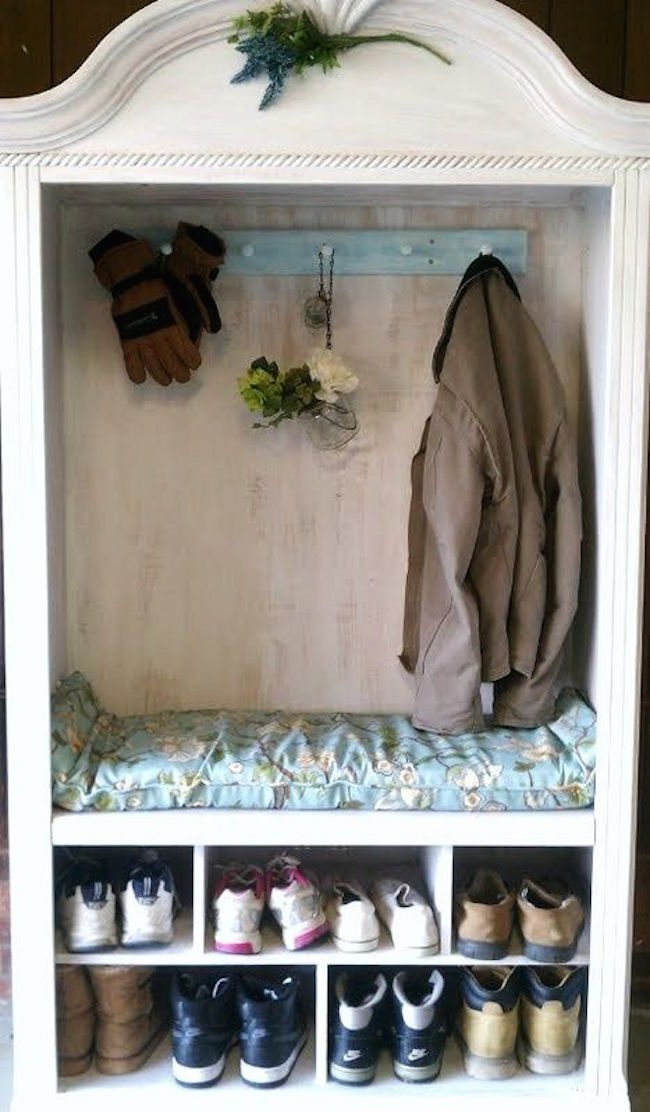 Armoire used for coat and shoe storage in a mudroom