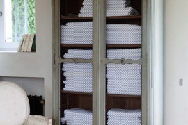 Armoire used to store bathroom towels