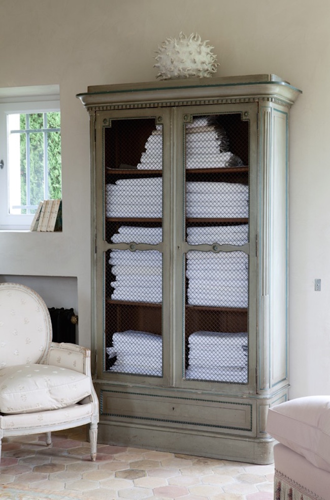 Armoire used to store bathroom towels
