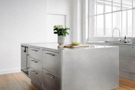 Base of the stainless steel kitchen island gives it a breezy appeal