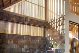 Bathroom with stone walls and freestanding bathtub