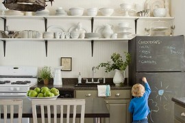 Breadboard wall and chalkboard elegance come together in this eclectic kitchen [Design: Lauren Liess Interiors]