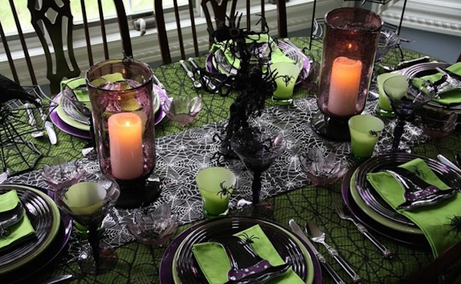 Black and green Halloween dinner setting with spiderwebs