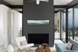 Breezy living room with gray fireplace wall