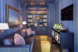 Brilliant monochromatic TV room in purple