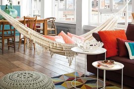 Colorful and bright apartment with a hammock in the living room