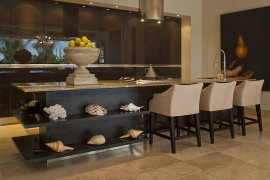 Conch shells and corals create a lovely display for the tropical kitchen