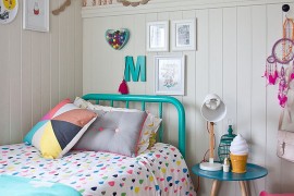 Decor and bedding bring the color into this eclectic bedroom