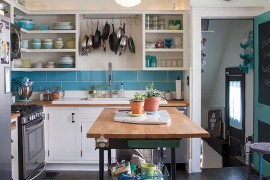 Eclectic kitchen with a light and breezy ambiance along with smart kitchen island [Photography: Adrienne DeRosa]