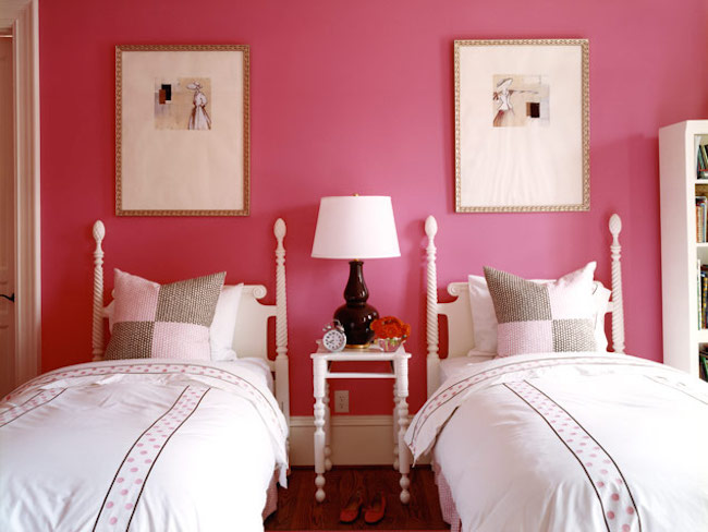 French cane beds against a boldly painted wall